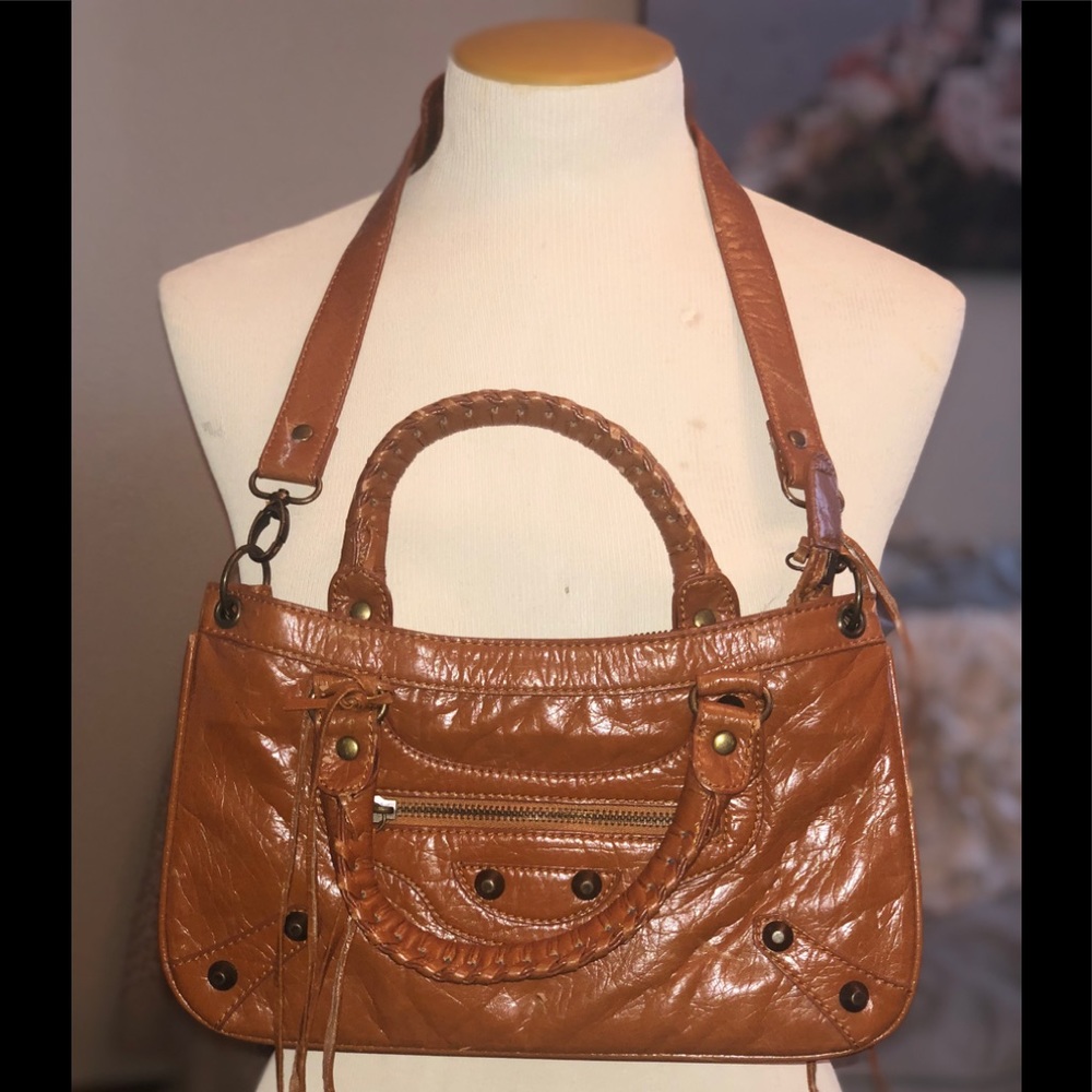 Adorable camel brown man made material purse.